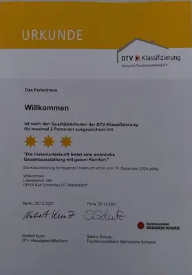 Ein Zertifikat, Auszeichnung, Logo oder anderes Dokument, das in der Unterkunft Ferienhaus Willkommen ausgestellt ist