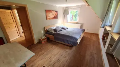 Ein Bett oder Betten in einem Zimmer der Unterkunft Ferienhaus Waldhäus'l