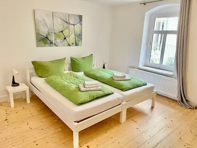 Ein Bett oder Betten in einem Zimmer der Unterkunft Meißner Elb-Domizil