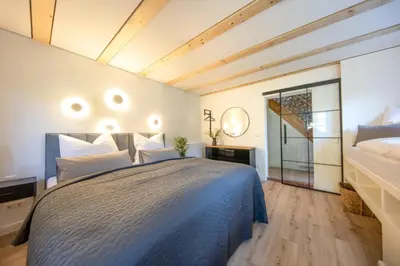 Ein Bett oder Betten in einem Zimmer der Unterkunft Traumhaftes Gästehaus an Elberadweg und Bastei