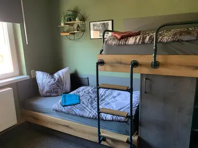 Ein Bett oder Betten in einem Zimmer der Unterkunft Gästezimmer in einer Ferienwohnung Thiele in Roßwein