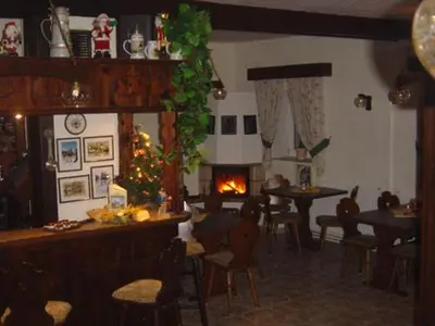 Ein Restaurant oder anderes Speiselokal in der Unterkunft Gaststätte & Pension Alte Mühle