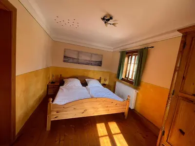Ein Bett oder Betten in einem Zimmer der Unterkunft Ferienwohnung im Erzgebirge