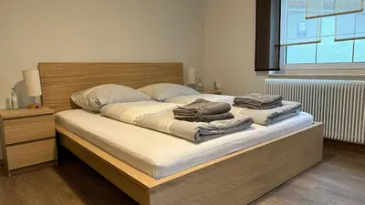 Ein Bett oder Betten in einem Zimmer der Unterkunft Ferienwohnung zum Winterberg