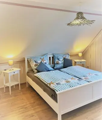 Ein Bett oder Betten in einem Zimmer der Unterkunft Haus-Am-See-Pratzschwitz