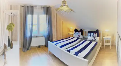 Ein Bett oder Betten in einem Zimmer der Unterkunft Haus-Am-See-Pratzschwitz