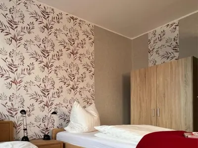 Ein Bett oder Betten in einem Zimmer der Unterkunft Ferienwohnung Landlust - ideal für Hundefreunde und Monteure, free WLAN & Parken, Smart-TV