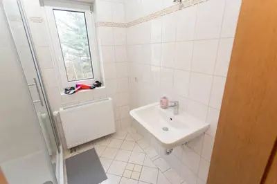 Ein Badezimmer in der Unterkunft Schickes 1-Raum-Apartment mit Balkon und vollausgestatteter Küche