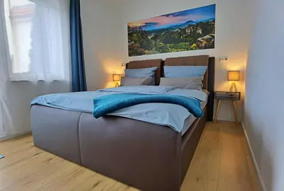 Ein Bett oder Betten in einem Zimmer der Unterkunft Moderne Ferienwohnung im Herzen von Königstein