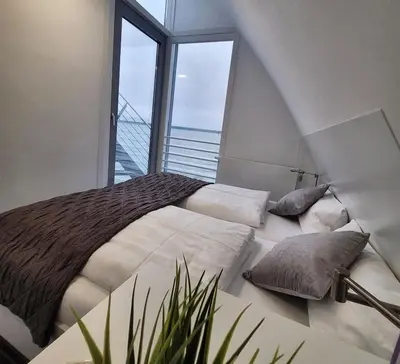 Ein Bett oder Betten in einem Zimmer der Unterkunft Ferienhaus Sky