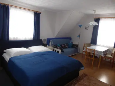 Ein Bett oder Betten in einem Zimmer der Unterkunft Apartment Rumrich