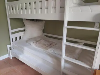 Ein Bett oder Betten in einem Zimmer der Unterkunft NEU! Ferienwohnung Böhlitz Neun