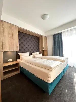 Ein Bett oder Betten in einem Zimmer der Unterkunft Familienapartment mit Panoramablick zur Frauenkirche