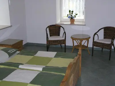 Ein Bett oder Betten in einem Zimmer der Unterkunft Ferienwohnung Vordermühle