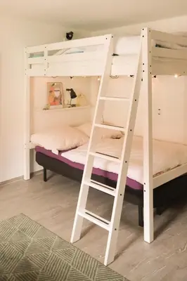 Ein Bett oder Betten in einem Zimmer der Unterkunft Haus Hummel Ferienwohnung Dora