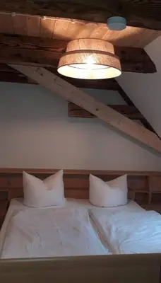 Ein Bett oder Betten in einem Zimmer der Unterkunft Erbgericht Putzkau
