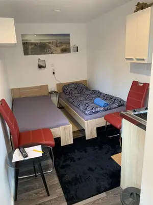 Ein Bett oder Betten in einem Zimmer der Unterkunft Tiny-Ferienwohnungen Hellerau