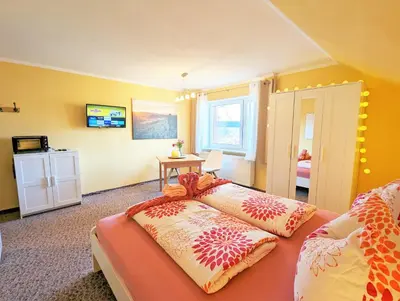 Ein Bett oder Betten in einem Zimmer der Unterkunft L5 - Urlaubsmagie - Mit Küche direkt am Wanderweg
