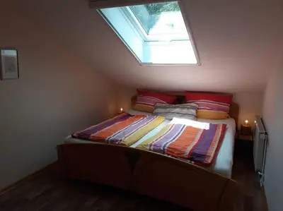 Ein Bett oder Betten in einem Zimmer der Unterkunft Ferienwohnungen Antonsruh im Kirnitzschtal