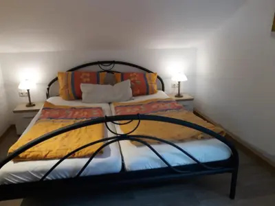 Ein Bett oder Betten in einem Zimmer der Unterkunft Ferienwohnungen Antonsruh im Kirnitzschtal