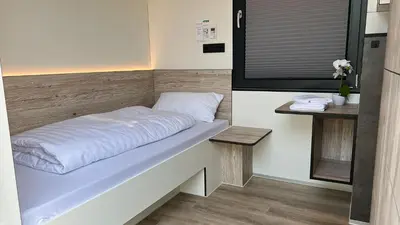 Ein Bett oder Betten in einem Zimmer der Unterkunft Roatel Schipkau (A13) my-roatel-com