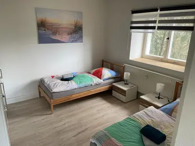 Ein Bett oder Betten in einem Zimmer der Unterkunft Monteur Ferienwohnungen OT Kleinwaltersdorf mit Außensitzecke und Grill