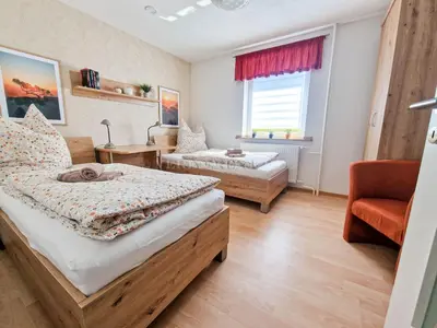 Ein Bett oder Betten in einem Zimmer der Unterkunft Hauptstraße 58a