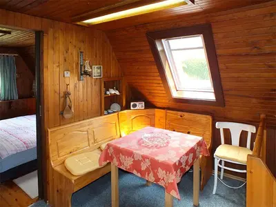 Ein Bett oder Betten in einem Zimmer der Unterkunft Ferienhaus Zum Gründel