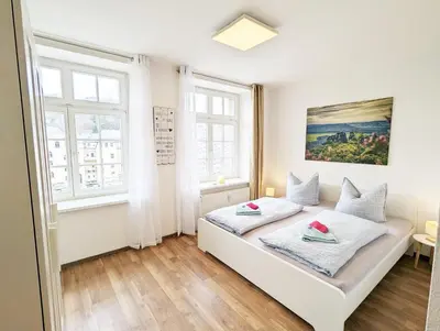 Ein Bett oder Betten in einem Zimmer der Unterkunft HW2 - Urlaubsmagie - Sauna & Pool für alle