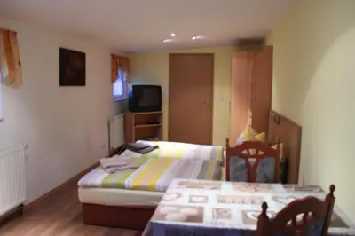 Ein Bett oder Betten in einem Zimmer der Unterkunft Pension Scheers