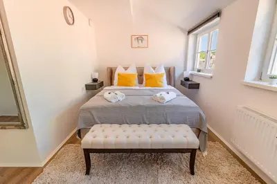 Ein Bett oder Betten in einem Zimmer der Unterkunft Daniels Apartment an der Schloßbrücke