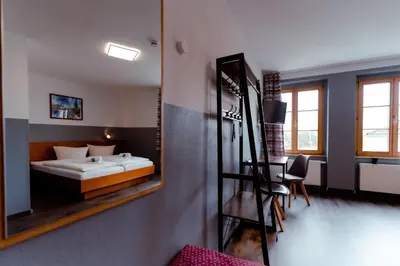Ein Bett oder Betten in einem Zimmer der Unterkunft Restaurant und Pension Alberthafen