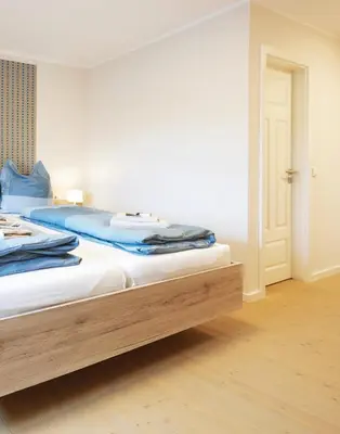 Ein Bett oder Betten in einem Zimmer der Unterkunft Pension 