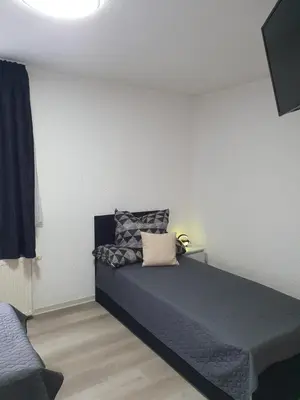 Ein Bett oder Betten in einem Zimmer der Unterkunft Pension Valentina