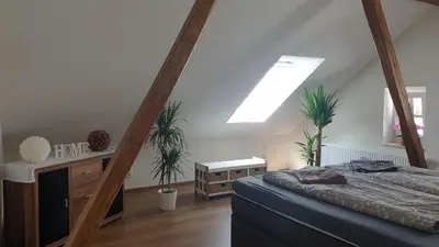 Ein Bett oder Betten in einem Zimmer der Unterkunft SeenSucht & Urlaubsträume, Ferienwohnung 